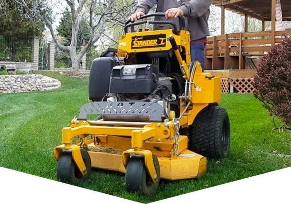 Professional grade lawn mower being used to mow grass.